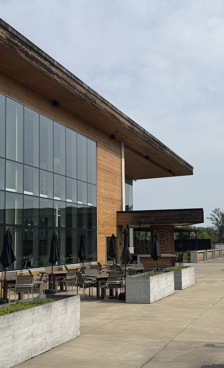 Bardstown Bourbon Company modern visitor center exterior with covered patio seating