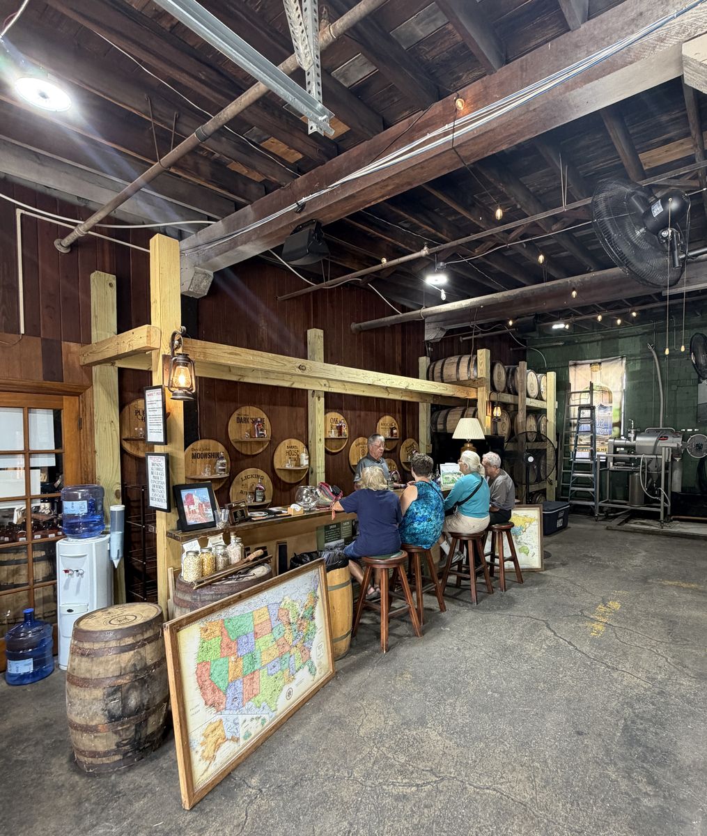 Barrel House tasting bar with visitors seated under exposed timber beams