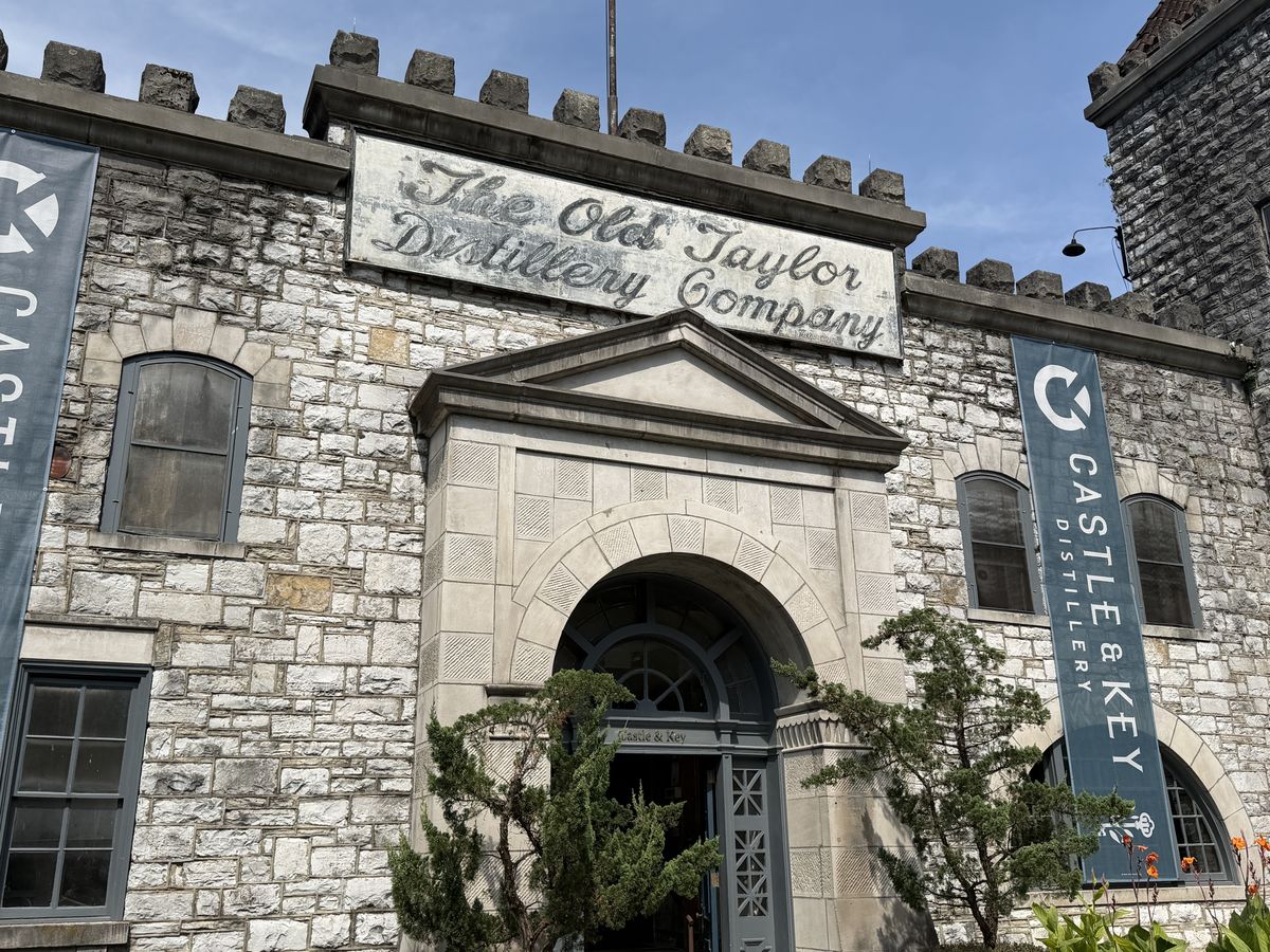 Stone castle entrance of the Old Taylor Distillery Company, now Castle and Key