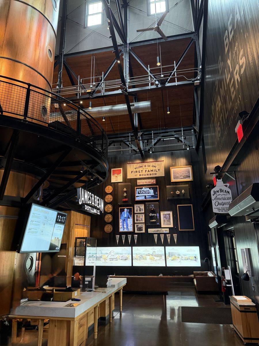 Interior of the Jim Beam stillhouse visitor center with high ceilings and a copper still