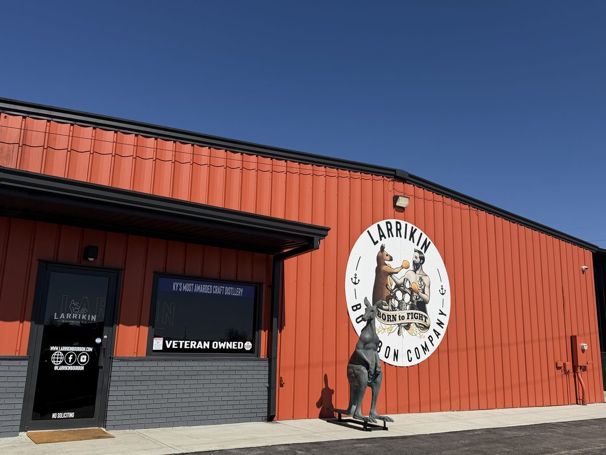 Larrikin Bourbon Company exterior with kangaroo statue and orange building