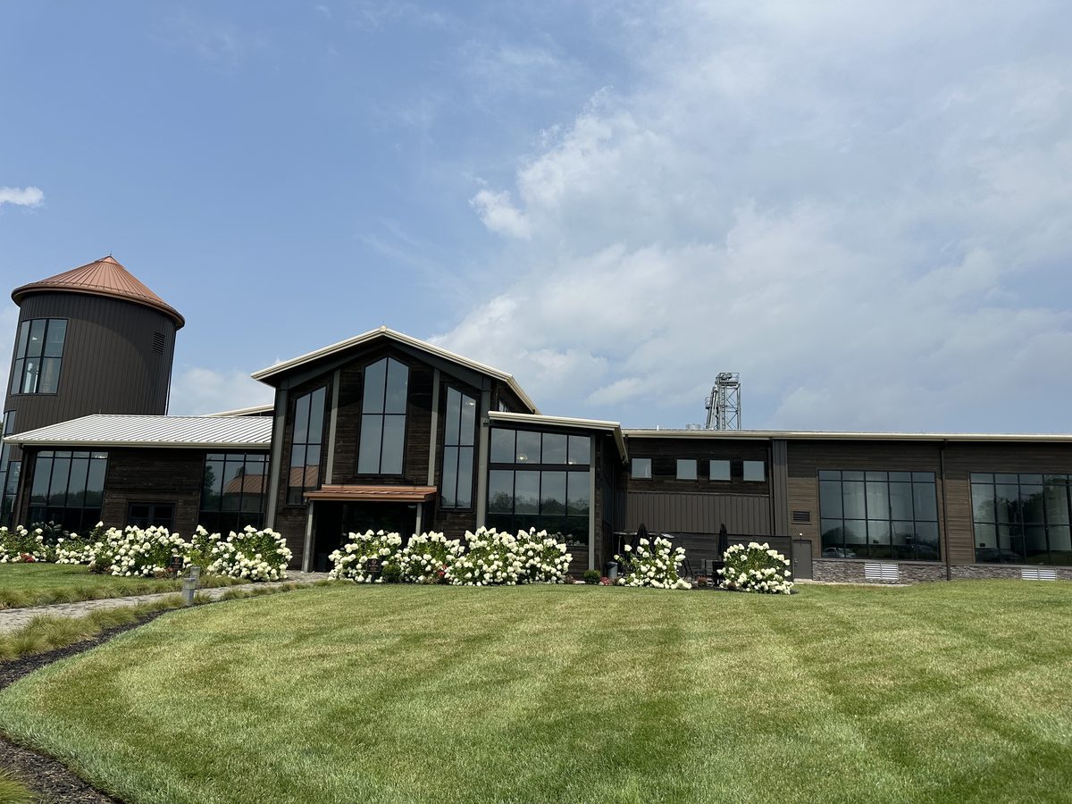 Lux Row Distillers exterior with modern architecture and hydrangeas