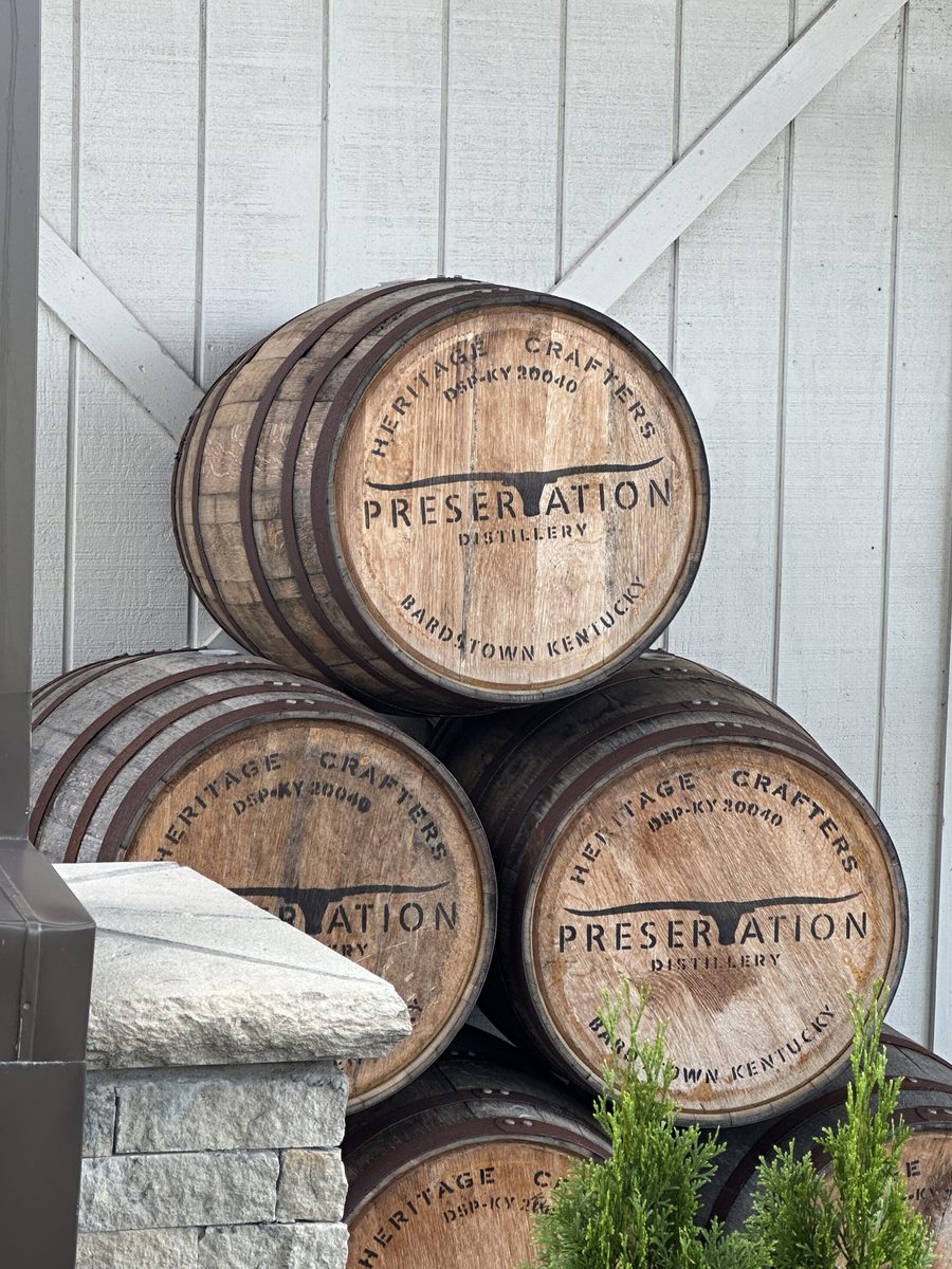 Preservation Distillery Heritage Crafters branded barrels stacked outside