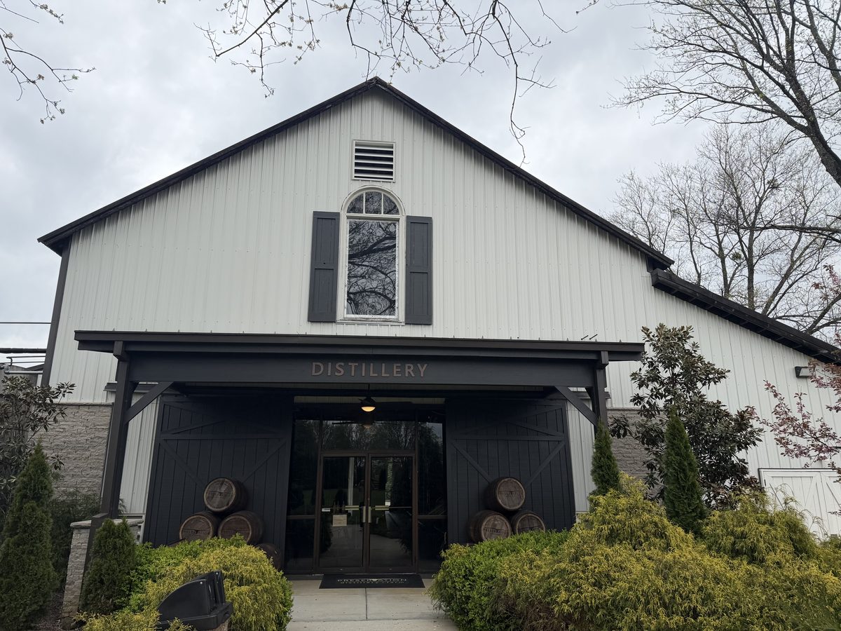 Preservation Distillery full exterior view of the white barn building