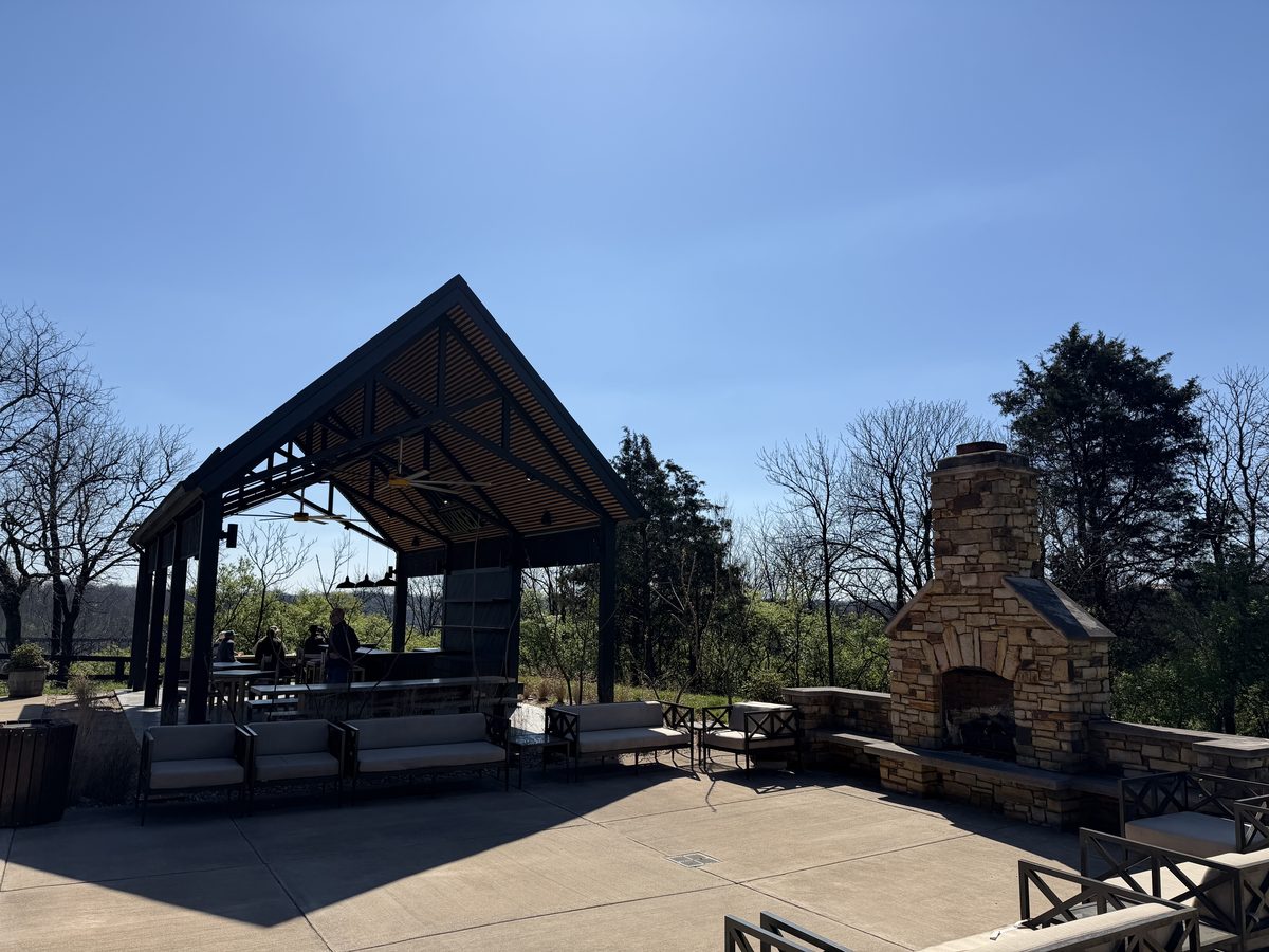 Wild Turkey outdoor patio with covered pavilion and stone fireplace
