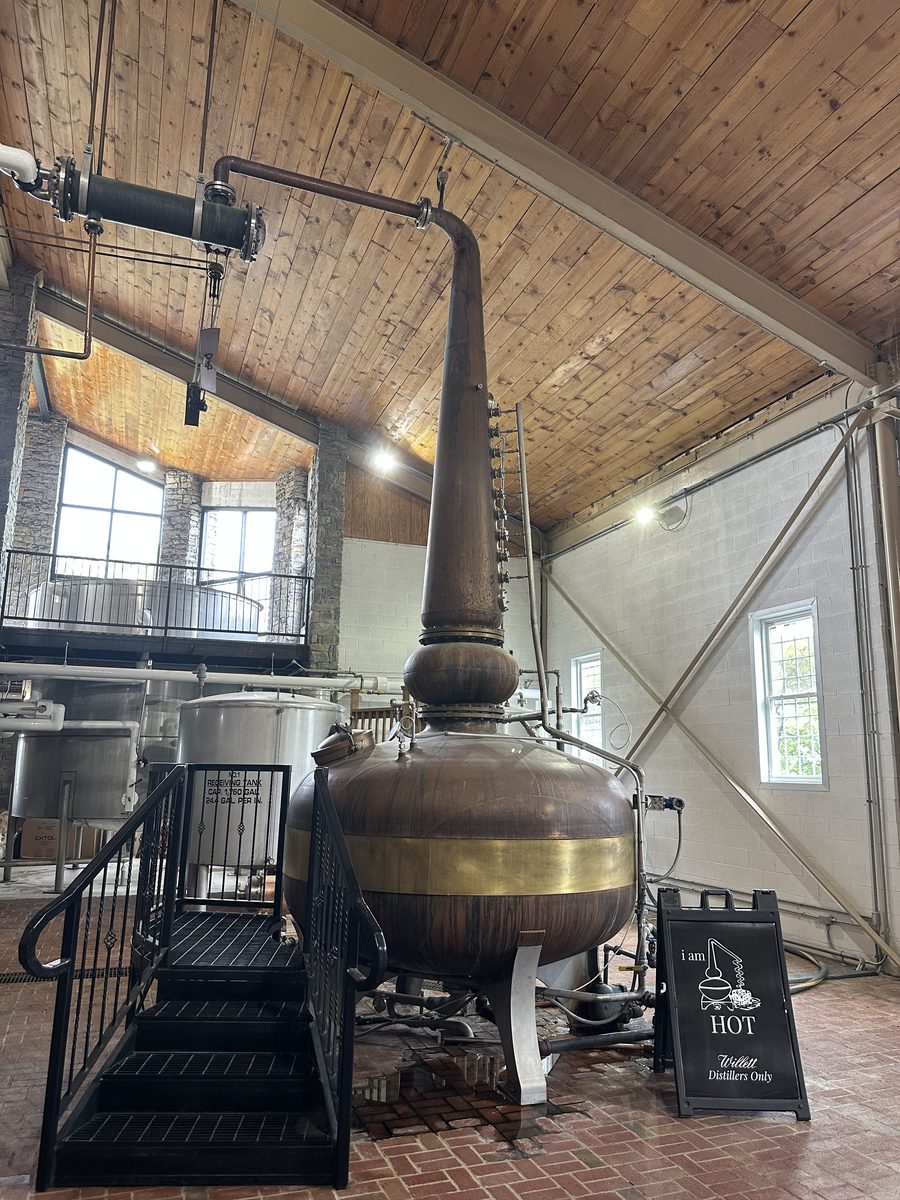 Willett copper pot still with I Am Hot sign inside the stillhouse