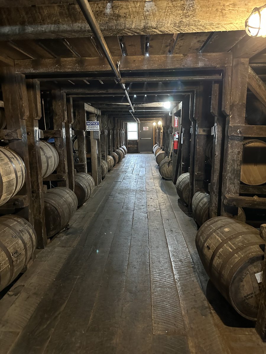 Inside a Willett rick house with rows of aging bourbon barrels